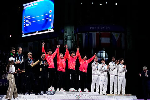 Fencers during 2024 Paris Olympics Games Fencing men's team foil competition medal ceremony